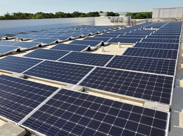 Rows of solar panels on a commercial flat roof