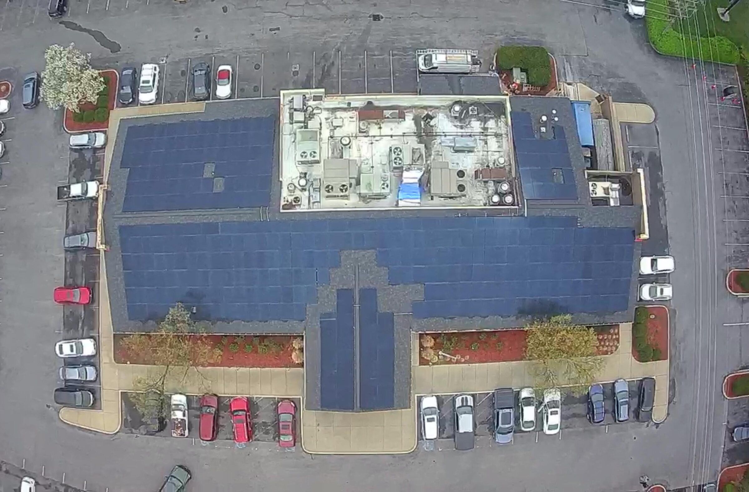 Aerial view of a Golden Corral restaurant roof covered in solar panels in Frederick, Maryland