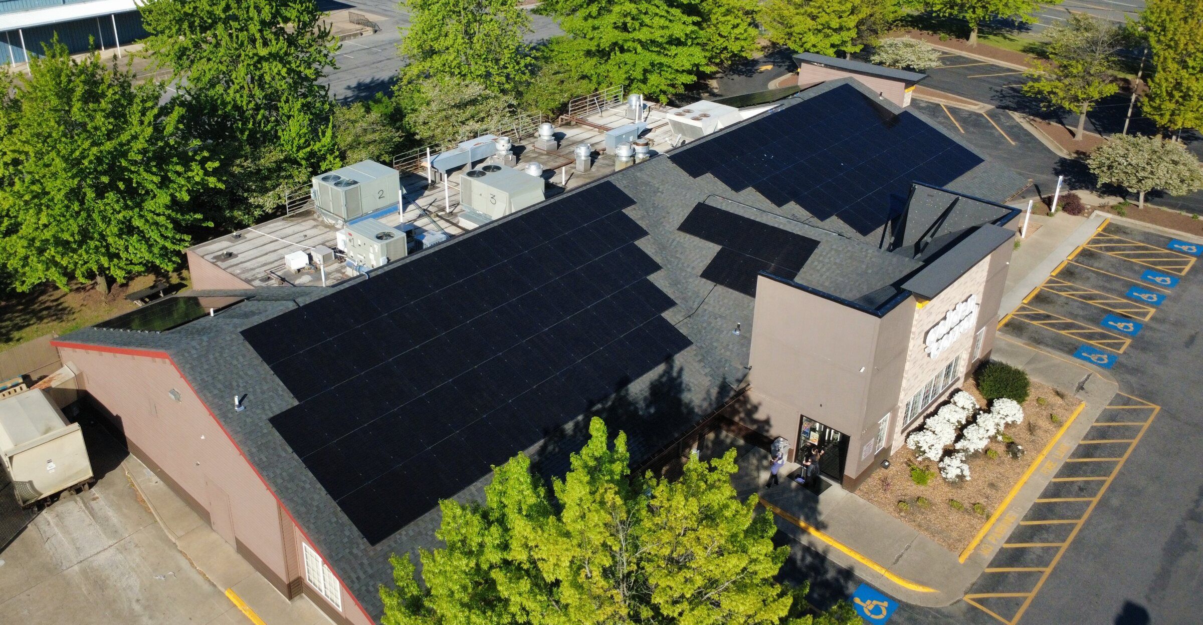Solar panels on the sloped roof of a Golden Corral restaurant in Winchester, Virginia