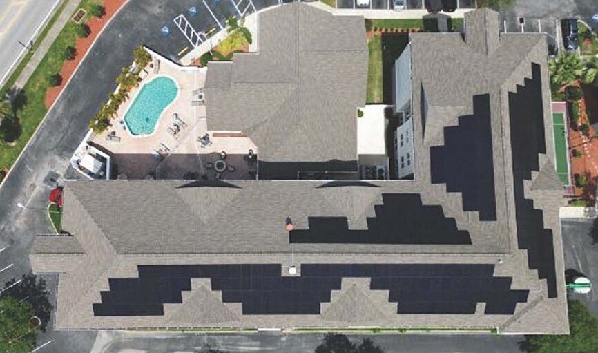 Overhead view of solar panels on the shingled roof of the Residence Inn in Oldsmar, Florida