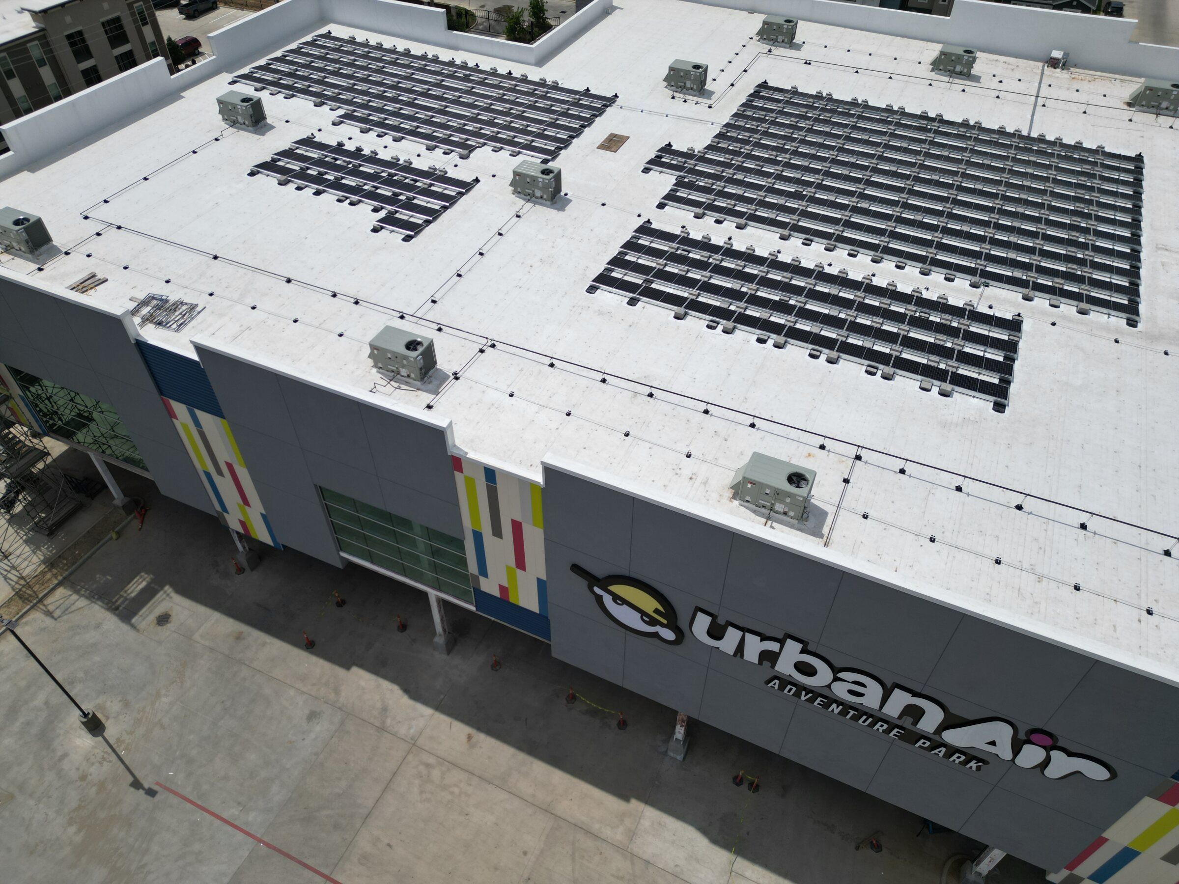 Ballasted solar rows on the flat roof of the Urban Air building in Houston